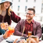 Friends having fun drinking at open air bar after work – Life st